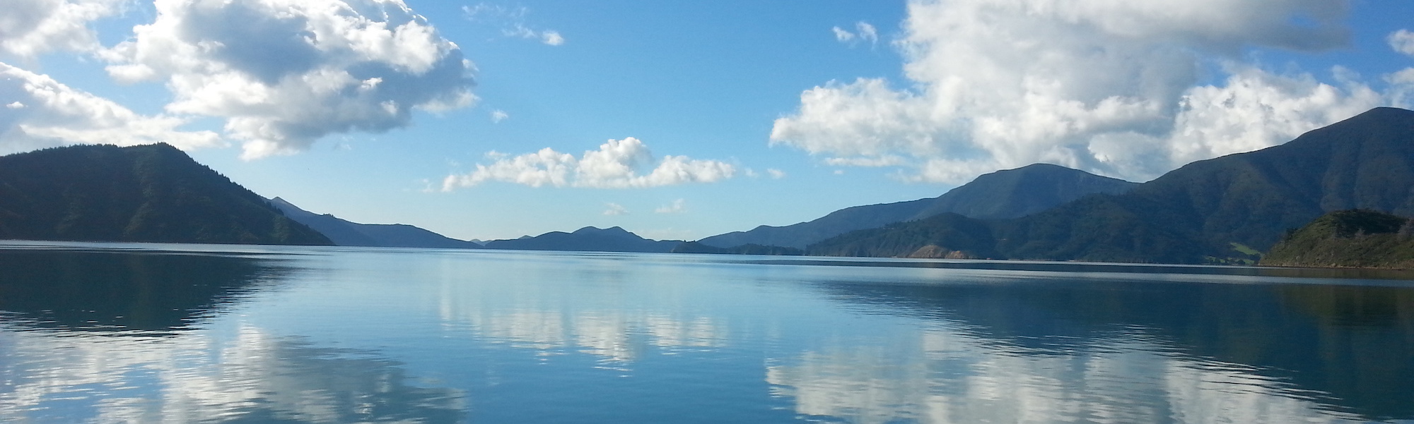 The Marlborough Sounds with calm water and bush covered hill backdrop is a unique and beautiful part of Marlborough.