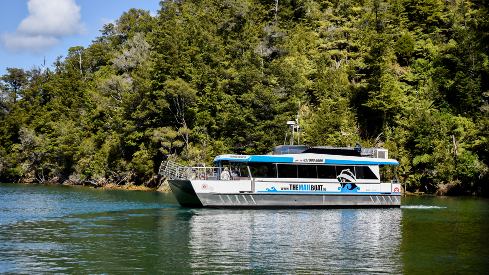 The Pelorus Mail Boat exploring a bay in Pelorus Sound/Te Horiere. 