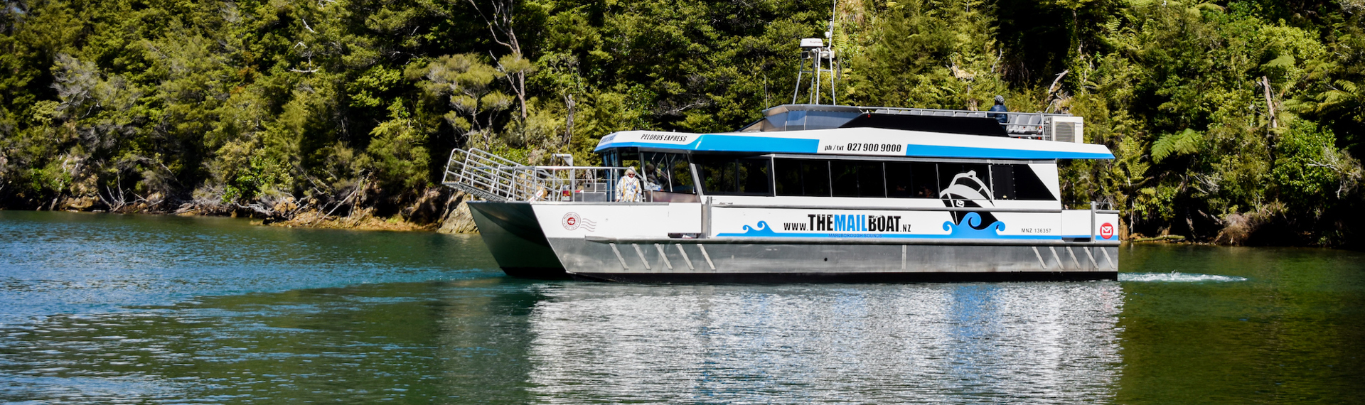 The Pelorus Mail Boat exploring a bay in Pelorus Sound/Te Horiere. 